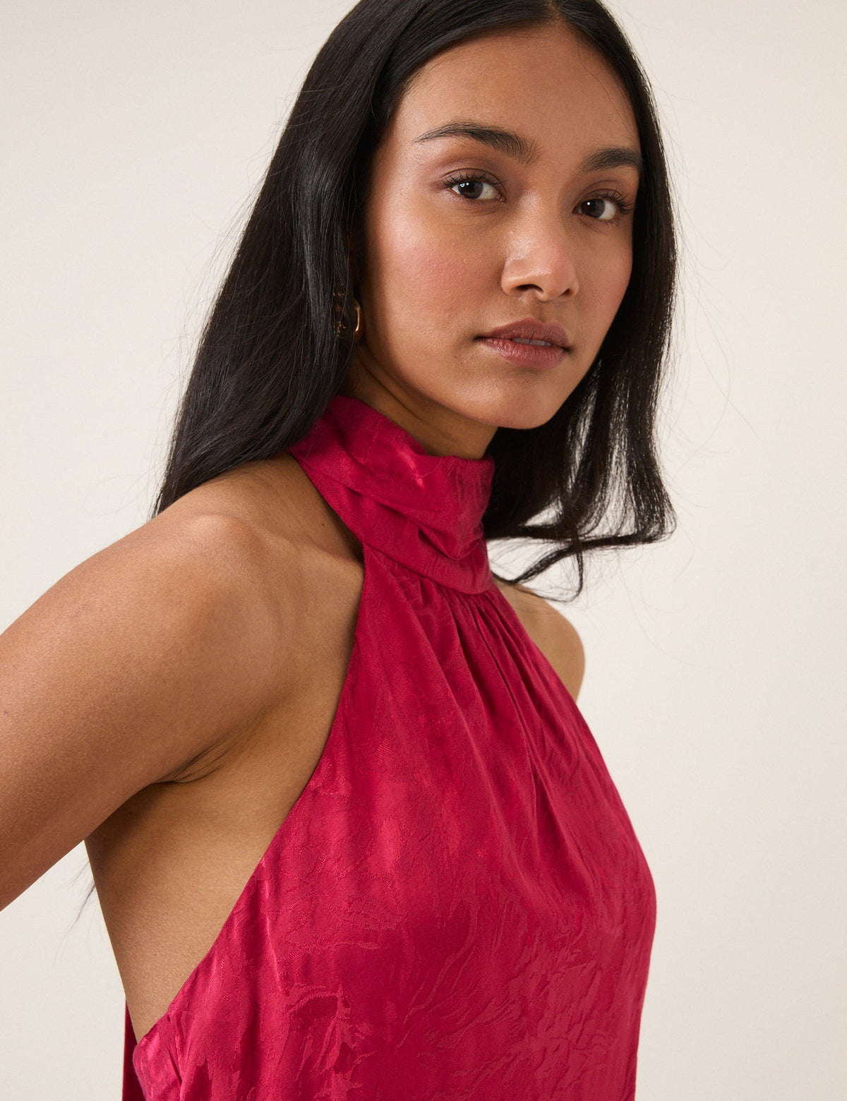 Women's pink sleeveless halter maxi dress with high neck and textured finish