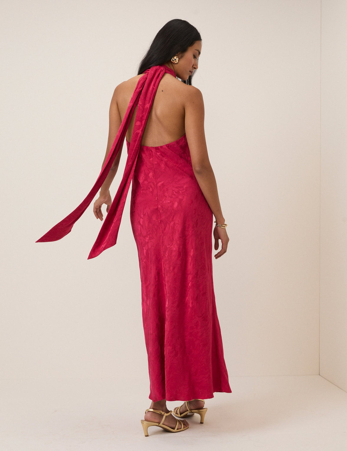 Women's pink sleeveless halter maxi dress with high neck and textured finish
