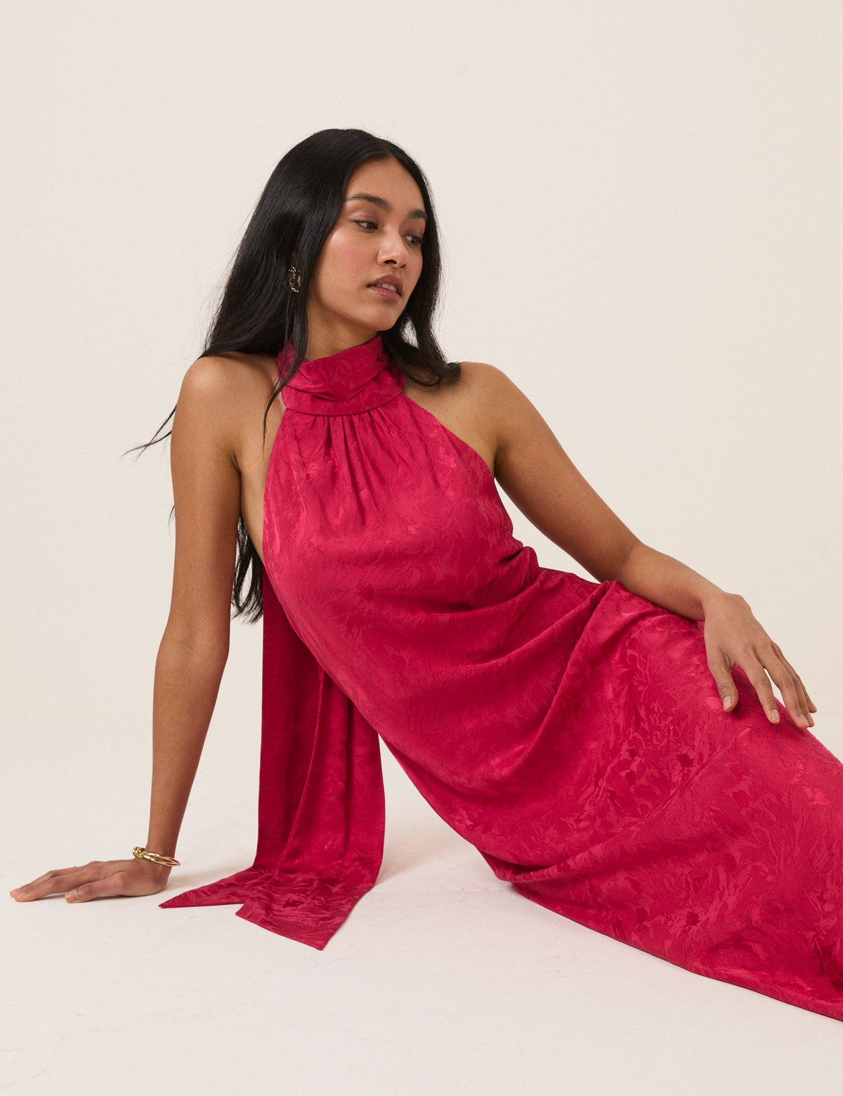 Women's pink sleeveless halter maxi dress with high neck and textured finish