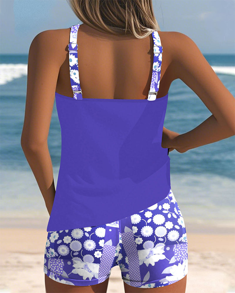 Women's floral tankini swimsuit with sleeveless top and matching shorts
