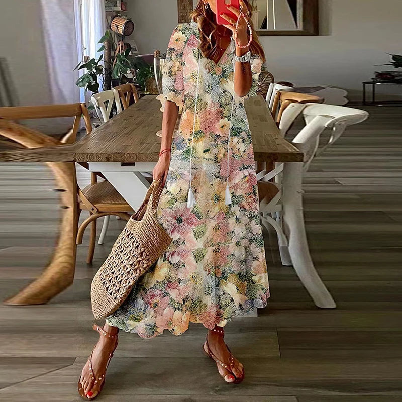 Women's floral bohemian maxi dress with short sleeves and tassel ties