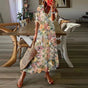 Women's floral bohemian maxi dress with short sleeves and tassel ties