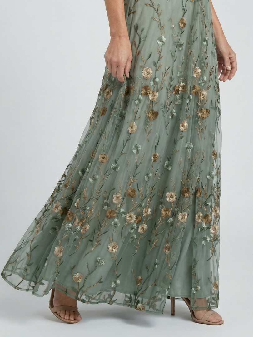 Women's green floral wrap maxi dress with V-neckline and flutter sleeves