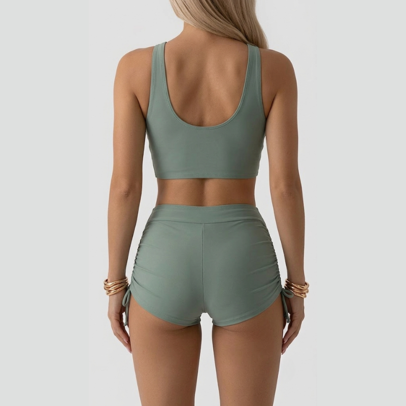 Women's green ruched bikini set with V-neck top and high-waisted shorts