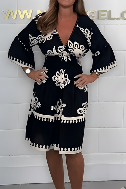 Women's floral boho mini dress with V-neckline and 3/4 sleeves