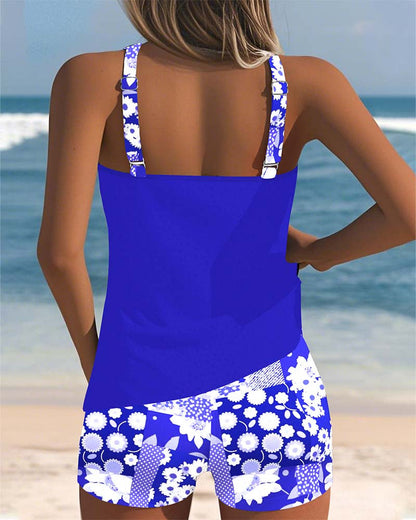Women's floral tankini swimsuit with sleeveless top and matching shorts