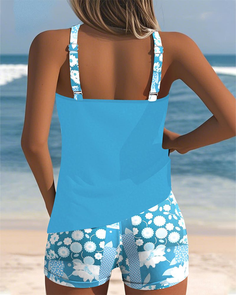 Women's floral tankini swimsuit with sleeveless top and matching shorts