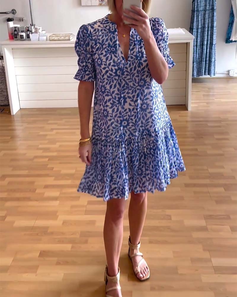 Women's floral mini dress with V-neck, puff sleeves and tiered skirt