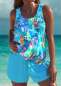 Women's blue printed sleeveless top and shorts set by the seaside