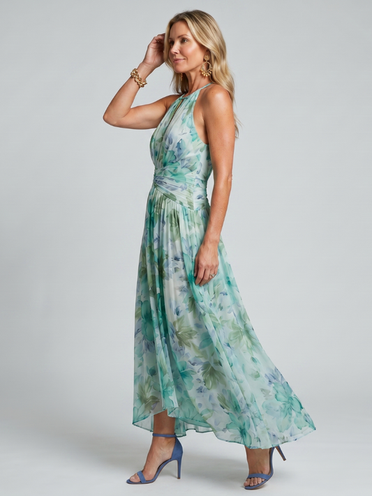 Women's green floral halter maxi dress with pleated waist and flowing skirt