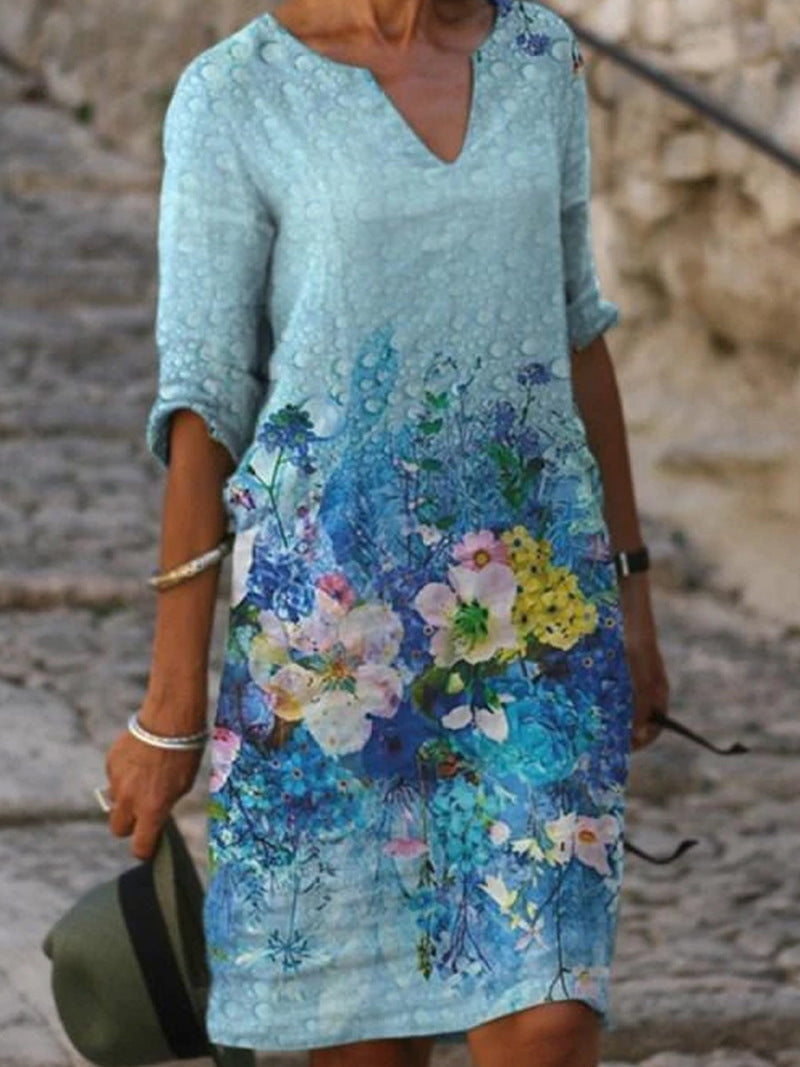 Women's printed knee-length shift dress with V-neck and three-quarter sleeves