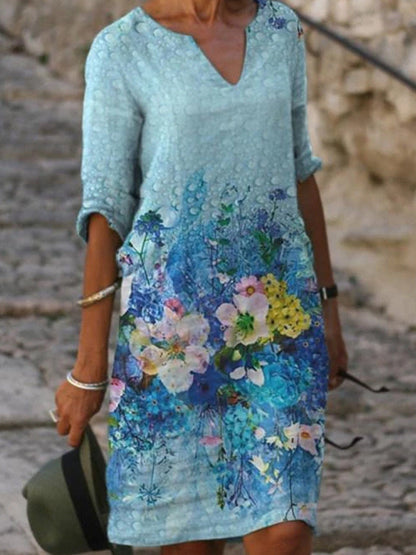 Women's printed knee-length shift dress with V-neck and three-quarter sleeves