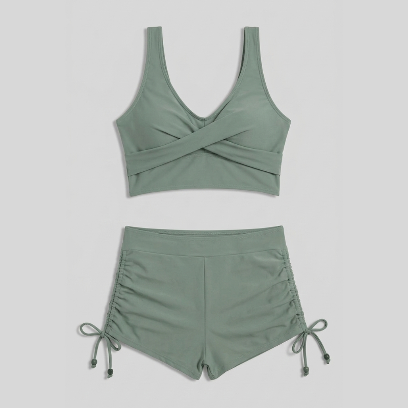 Women's green ruched bikini set with V-neck top and high-waisted shorts