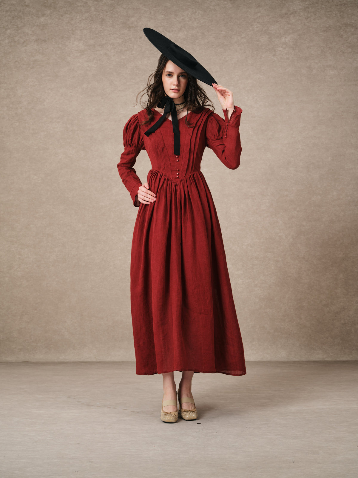 Women's tailored button-front corset maxi dress with long puff sleeves and a full gathered skirt