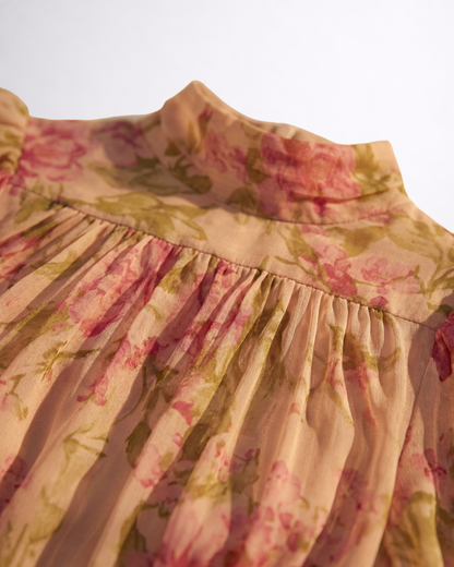 Women's pink floral maxi dress with high neck, puff sleeves and ruffled hem