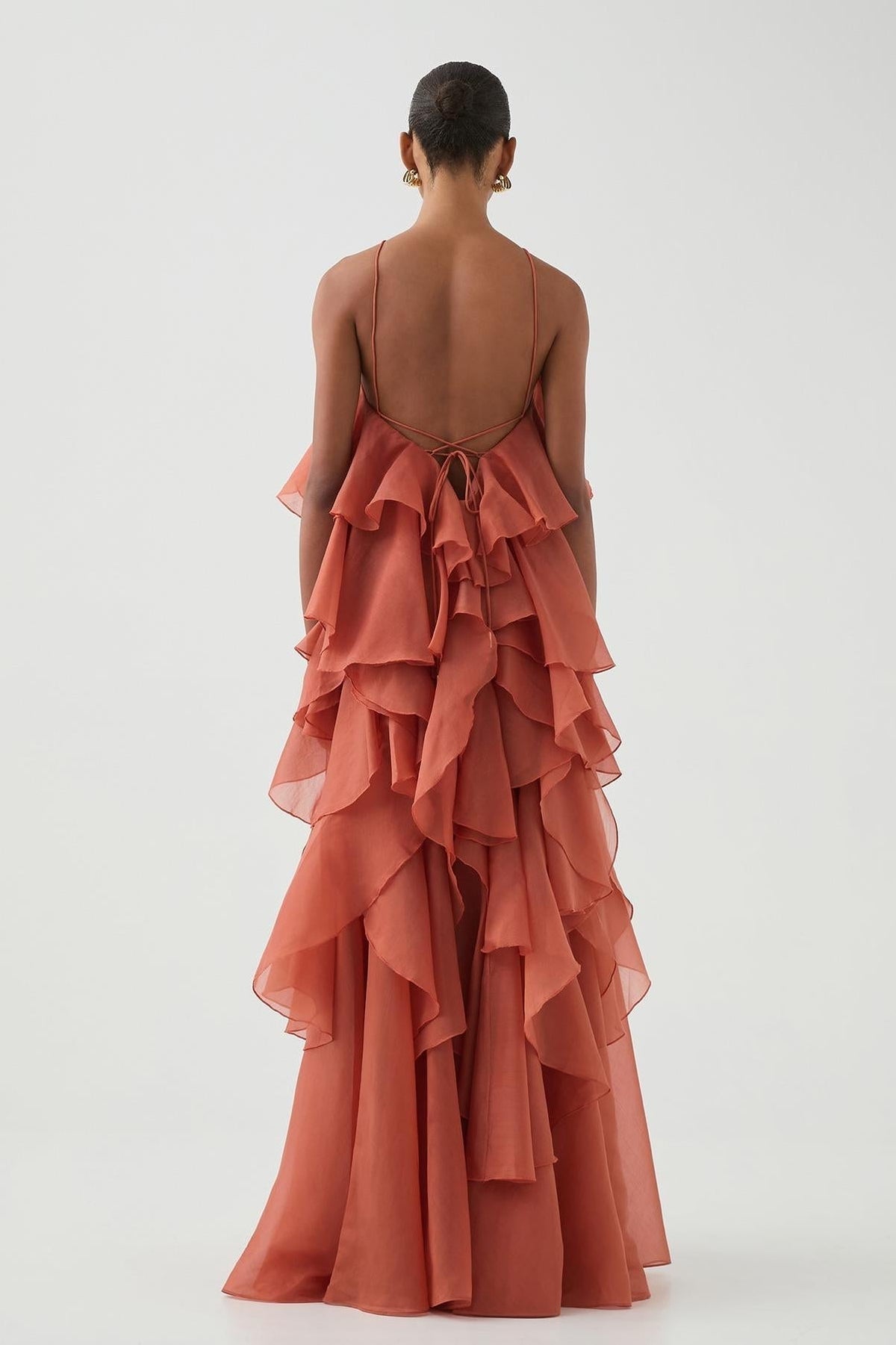 Women's coral sleeveless halter maxi dress with layered ruffles and front flower detail