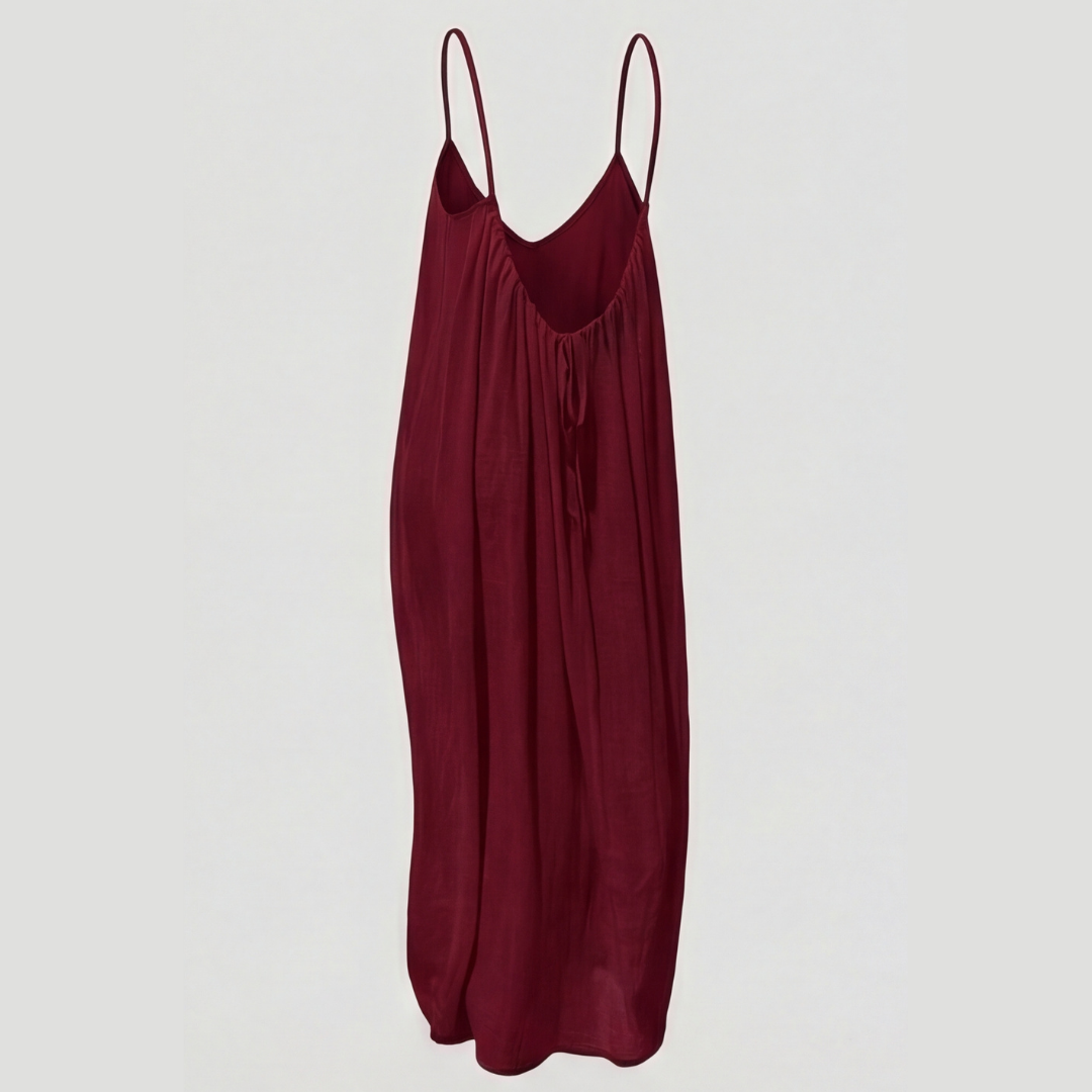 Women's flowing backless maxi dress with V-neckline and spaghetti straps