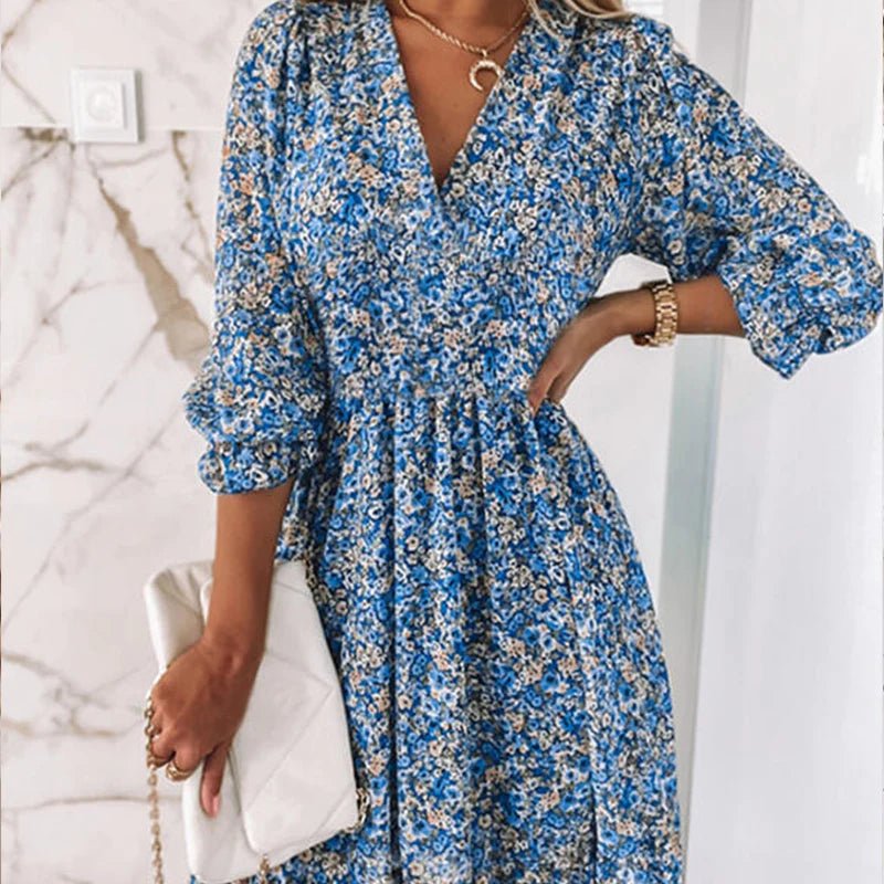 Women's floral V-neck mini dress with 3/4 sleeves and smocked waist