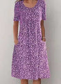 Women's floral midi dress with short sleeves, round neckline and side pockets