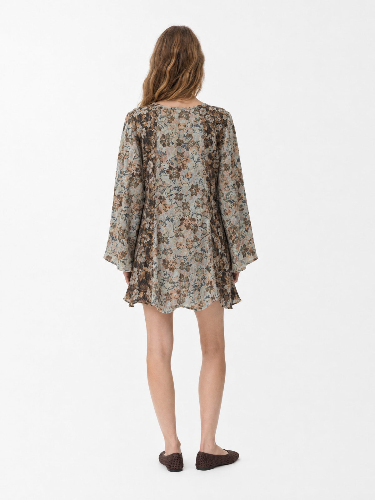 Women's floral patchwork mini dress with long flared sleeves and front tie neckline