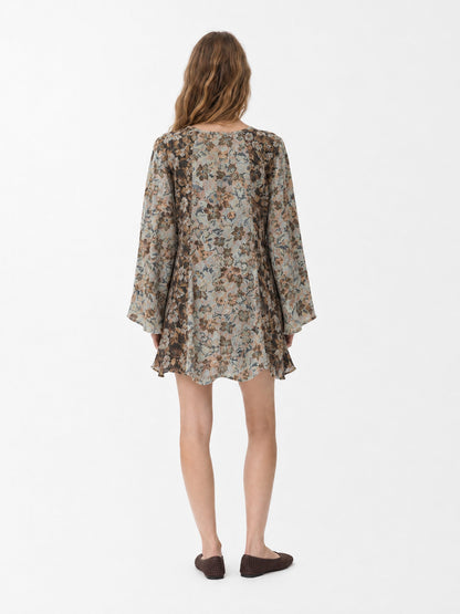 Women's floral patchwork mini dress with long flared sleeves and front tie neckline