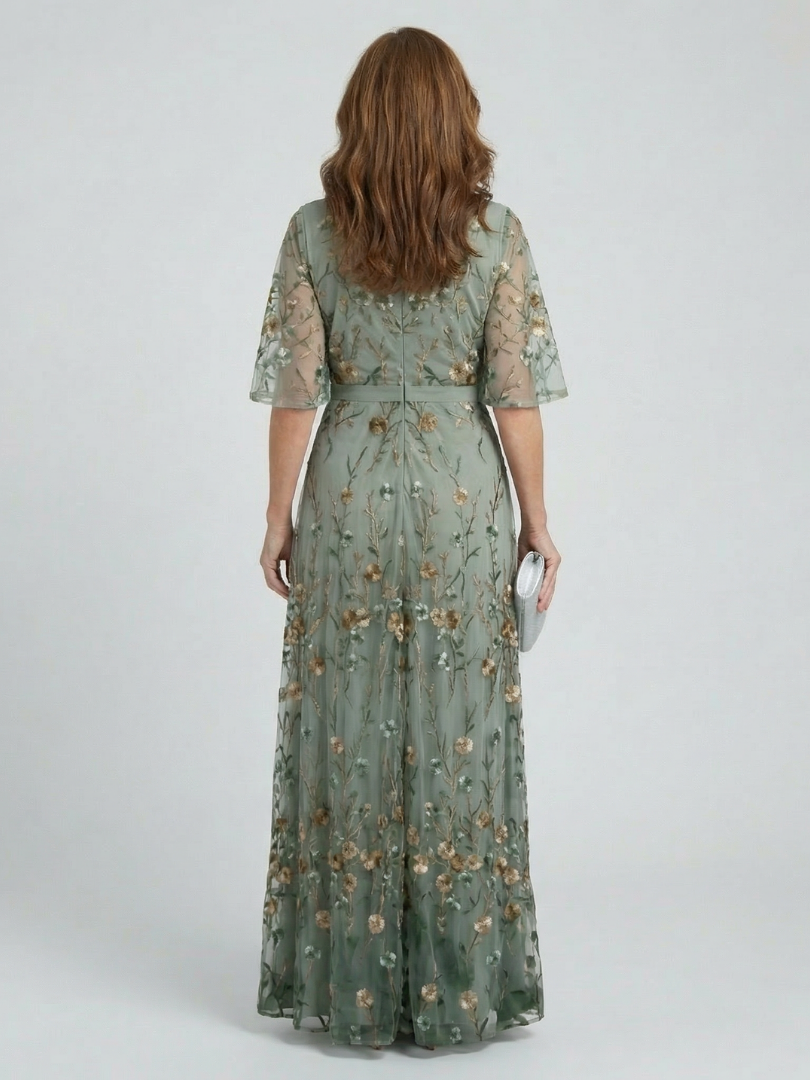 Women's green floral wrap maxi dress with V-neckline and flutter sleeves