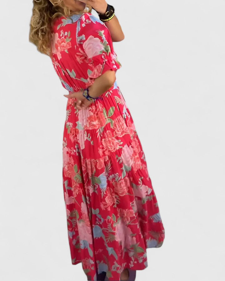 Women's floral V-neck maxi dress with short sleeves and a flowing skirt