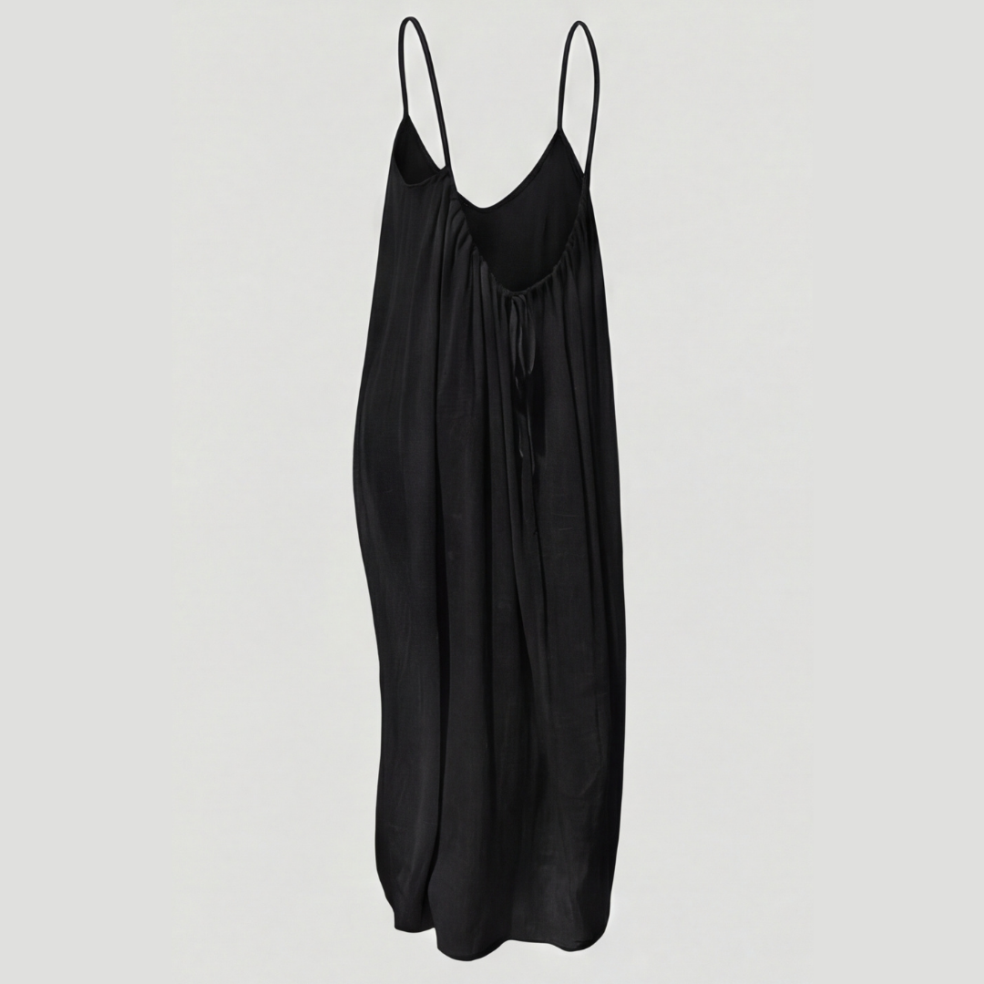 Women's flowing backless maxi dress with V-neckline and spaghetti straps