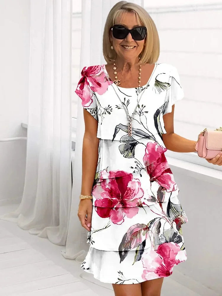 Women's patterned short sleeve dress with round neckline and tiered skirt