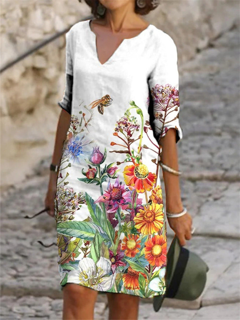Women's printed knee-length shift dress with V-neck and three-quarter sleeves