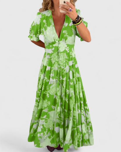 Women's floral V-neck maxi dress with short sleeves and a flowing skirt