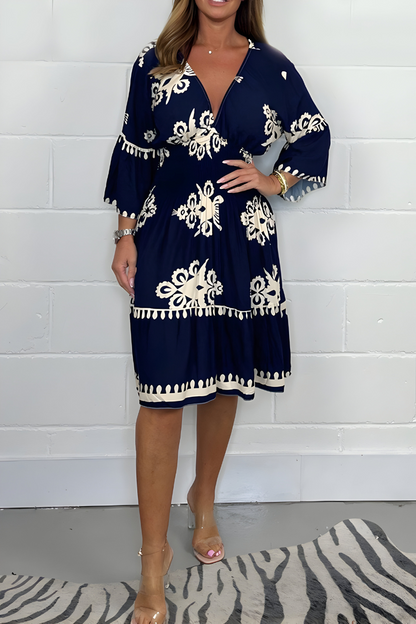 Women's floral boho mini dress with V-neckline and 3/4 sleeves