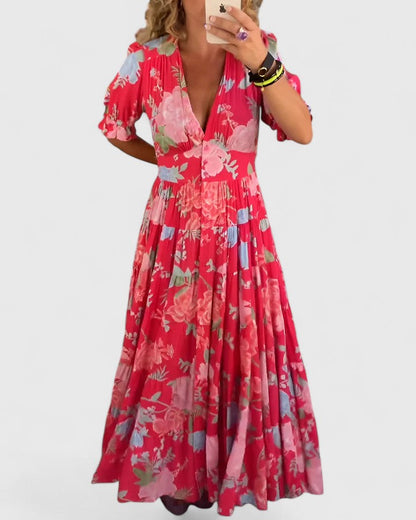 Women's floral V-neck maxi dress with short sleeves and a flowing skirt