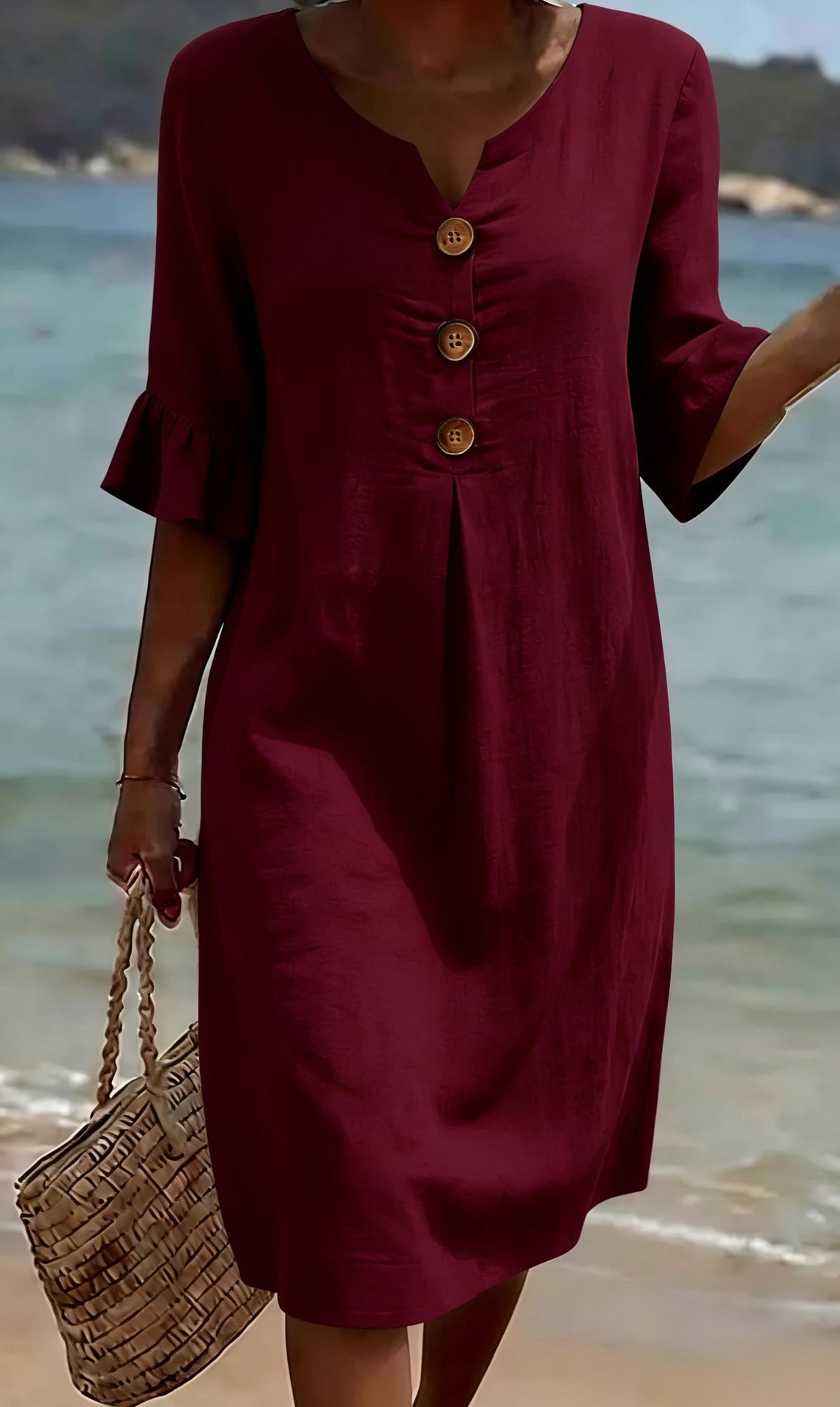 Women's relaxed knee-length button-front dress with split neckline and elbow-length sleeves