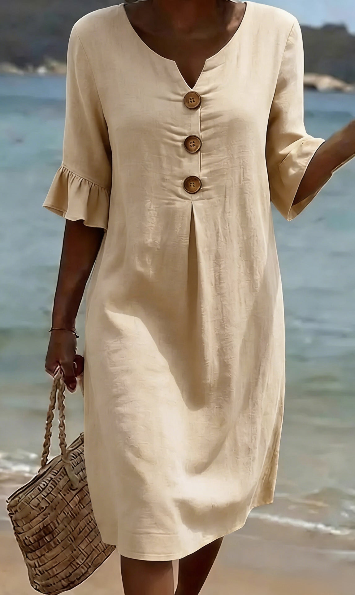 Women's relaxed knee-length button-front dress with split neckline and elbow-length sleeves