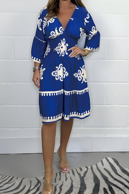 Women's floral boho mini dress with V-neckline and 3/4 sleeves