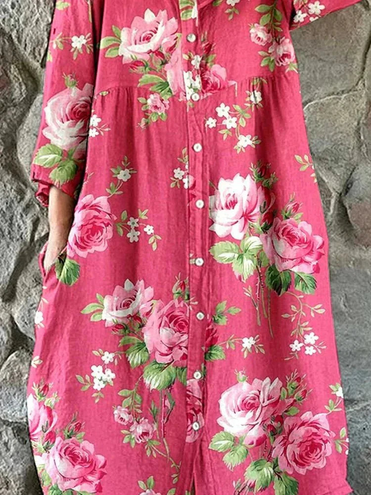 Women's pink floral button-front dress with V-neckline and 3/4 sleeves
