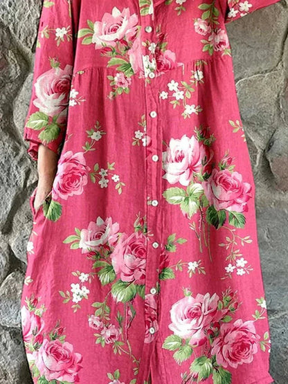 Women's pink floral button-front dress with V-neckline and 3/4 sleeves
