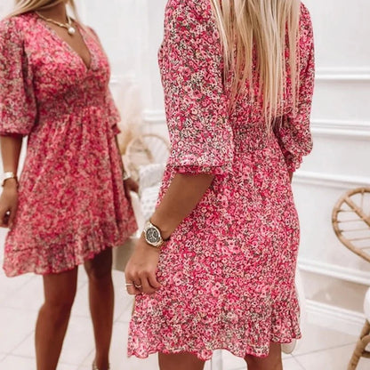 Women's floral V-neck mini dress with 3/4 sleeves and smocked waist