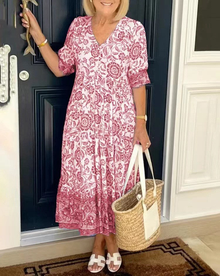 Women's floral V-neck midi dress with three-quarter sleeves and tiered skirt