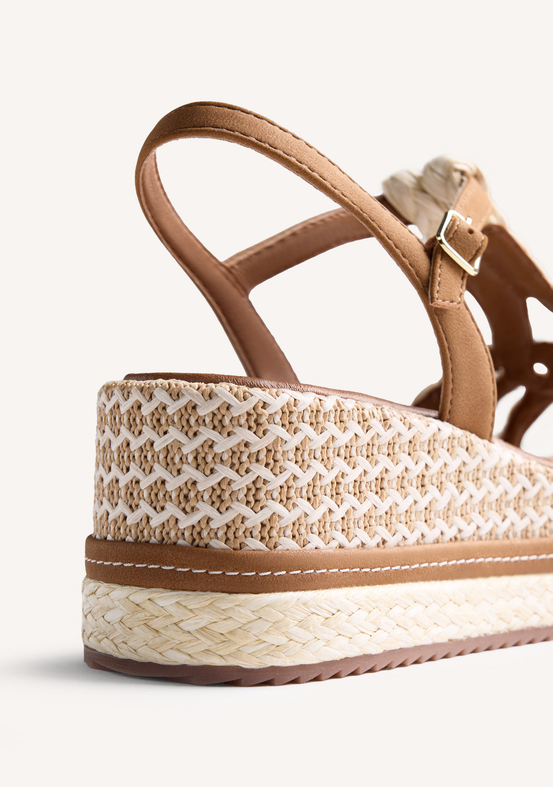 Women's brown wedge sandals with braided straps and ankle buckle