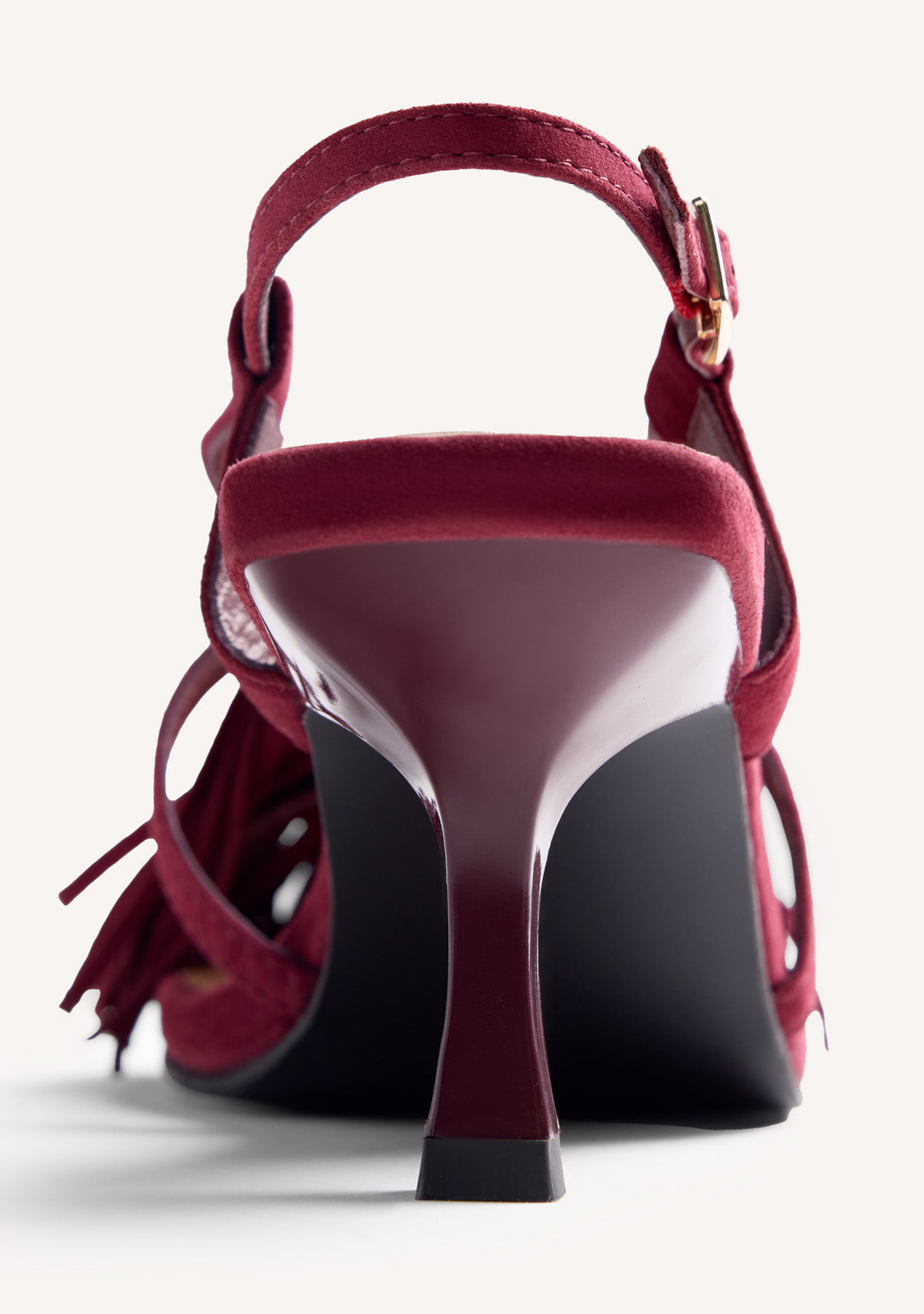 Women's burgundy high-heeled sandals with long fringe front and buckle ankle straps