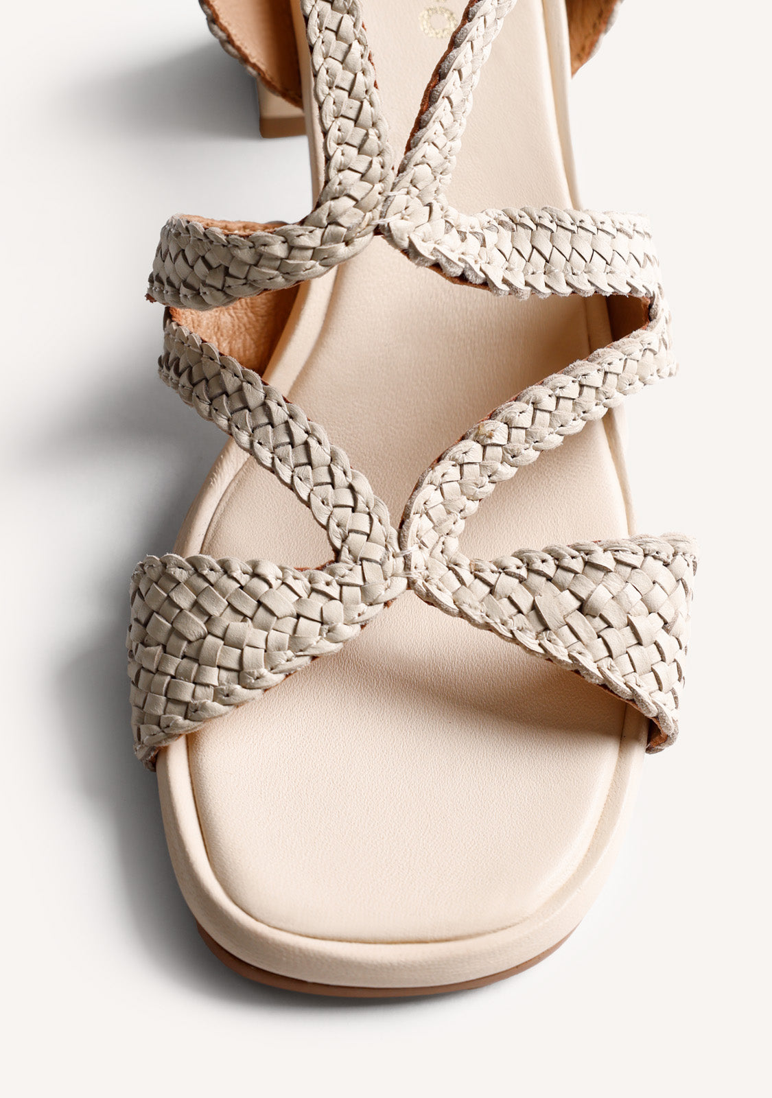 Cream woven heeled sandals with ankle buckle and square toe