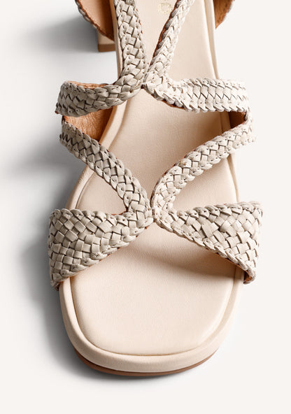 Cream woven heeled sandals with ankle buckle and square toe