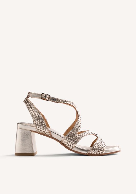 Women's metallic gold woven heeled sandals with ankle buckle straps