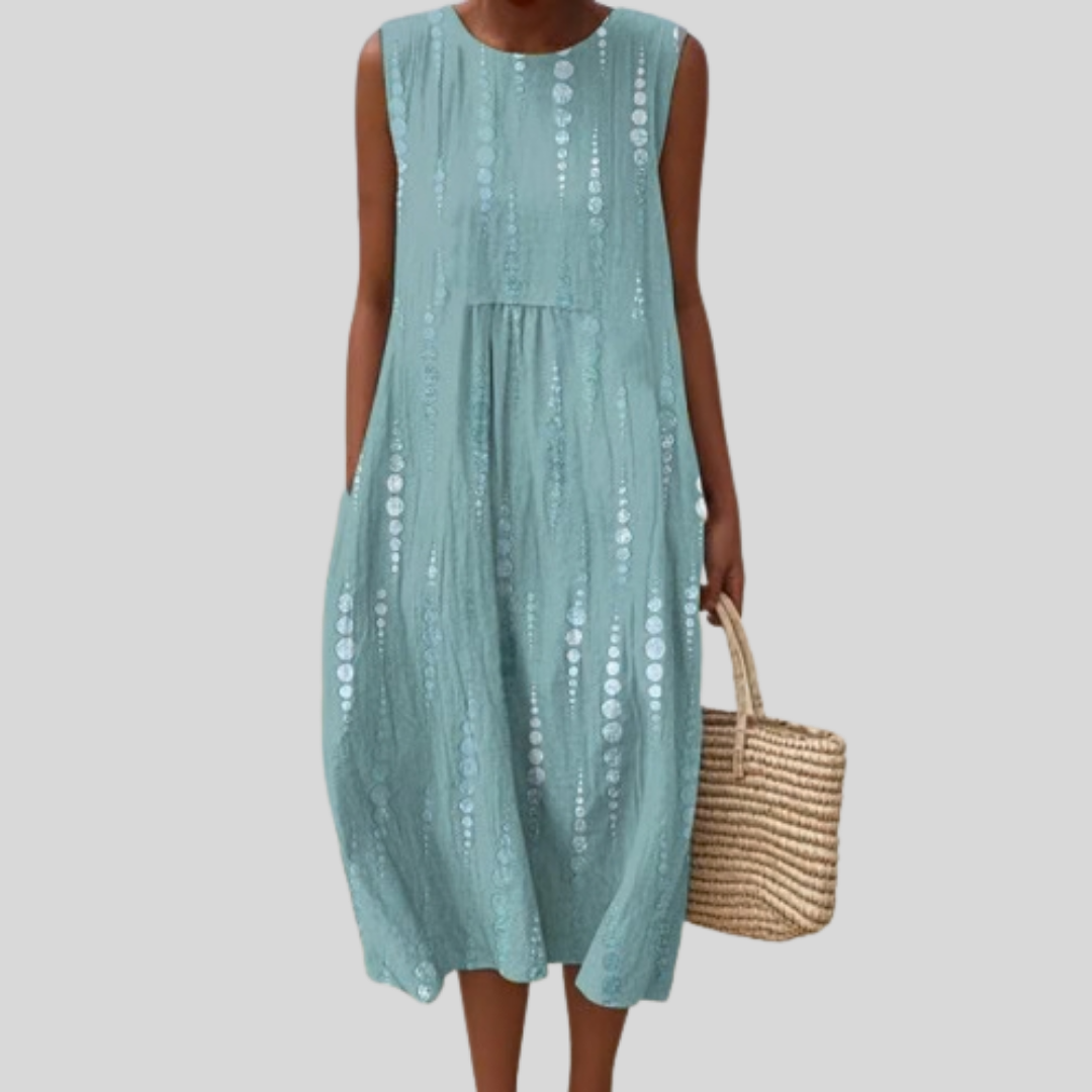 Women's blue sleeveless eyelet midi dress with round neckline, gathered seam and side pockets