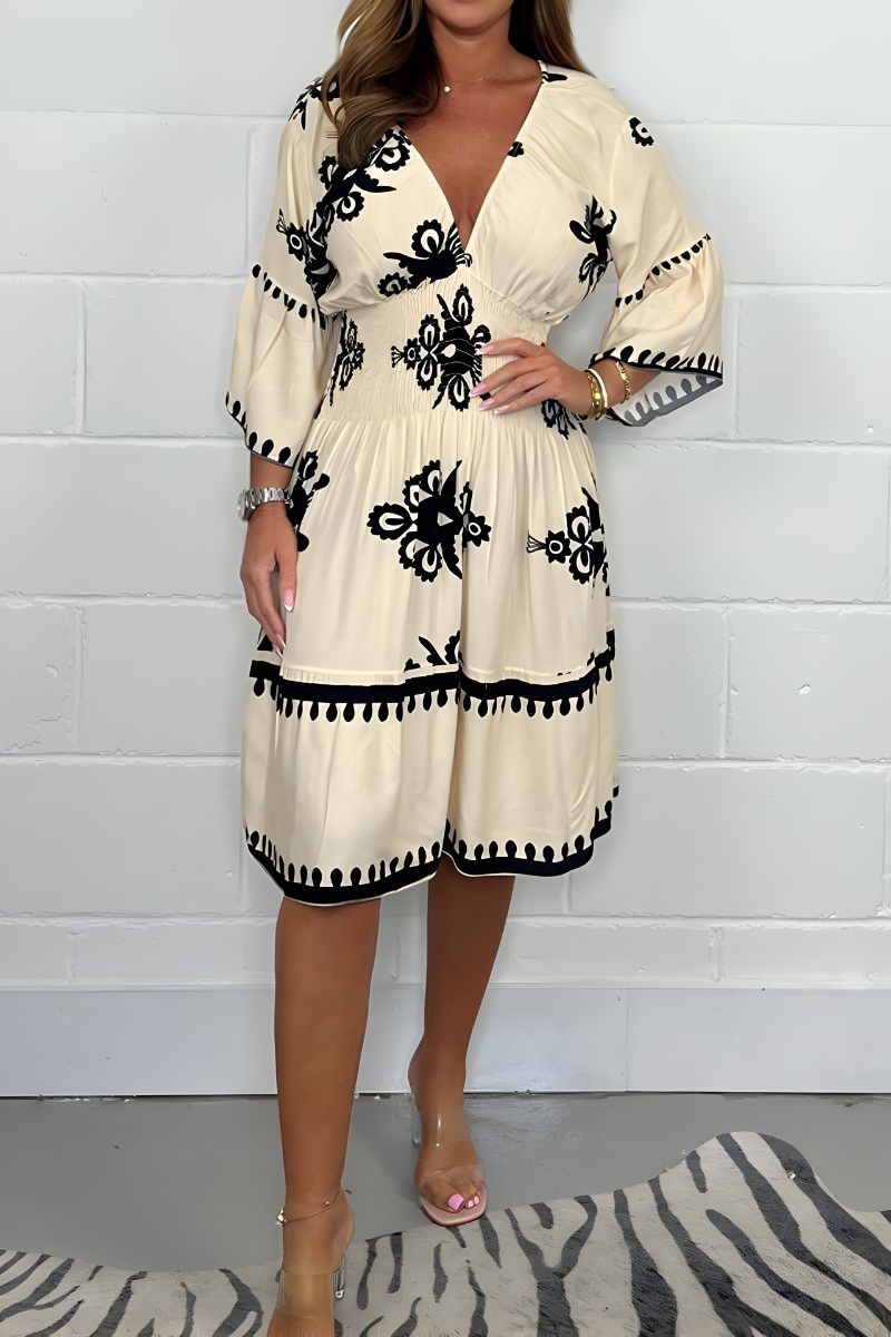 Women's floral boho mini dress with V-neckline and 3/4 sleeves
