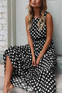Women's sleeveless polka dot midi dress with a round neckline and flowing skirt
