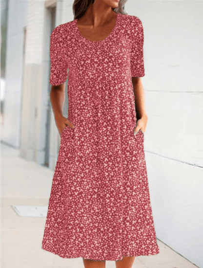 Women's floral midi dress with short sleeves, round neckline and side pockets