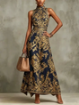 Women's sleeveless halter maxi dress with ornate baroque print and flowing skirt
